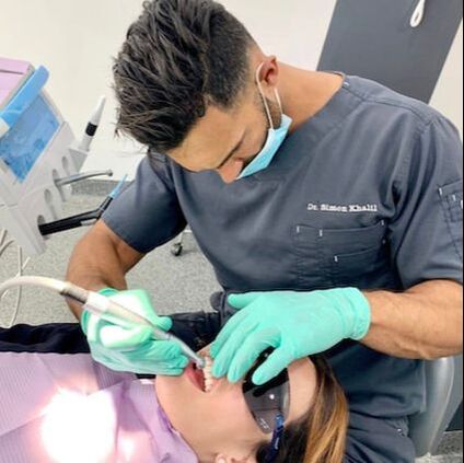 Petersham Dentist performing dental treatment on a patient.