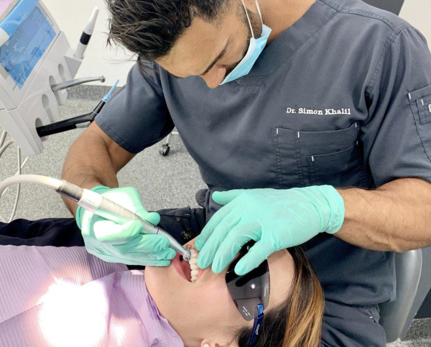 Dentist performs wisdom tooth extraction on patient in Petersham